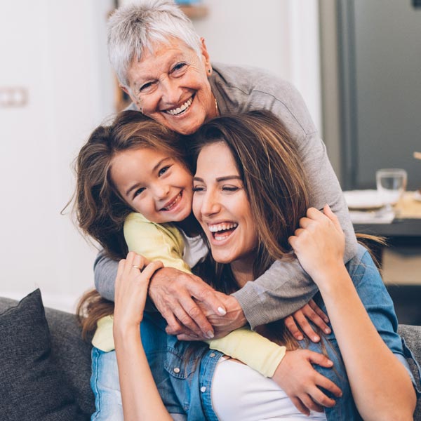family of three laughing together
