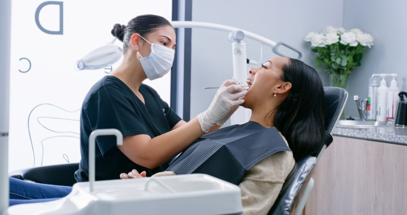 Patient gets teeth checked by dentist in Plainfield, IN.