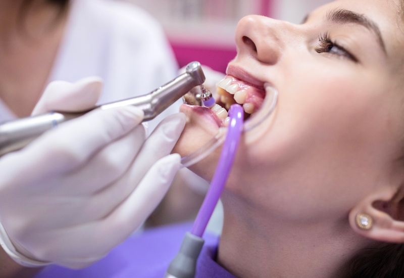 Plainfield, IN dental expert providing oral care to a patient.