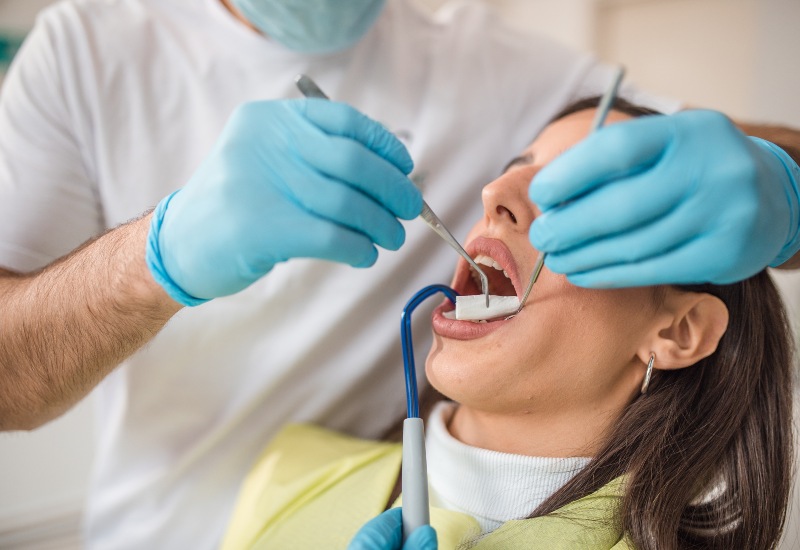 Patient receives oral hygiene care from dentist in Plainfield, IN